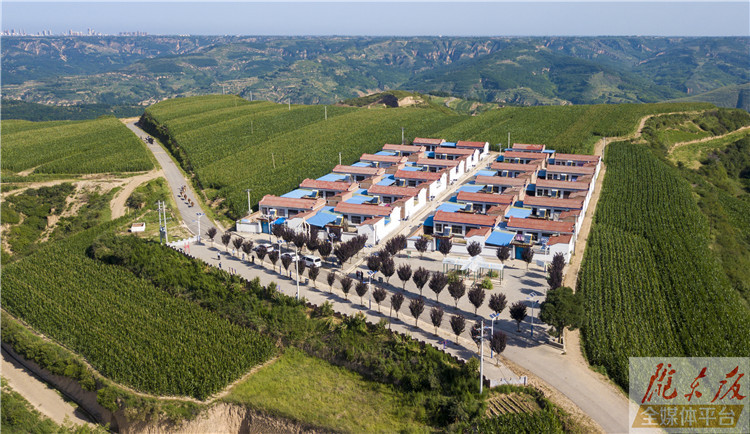 水泥路通门口 龙咀子村大变样