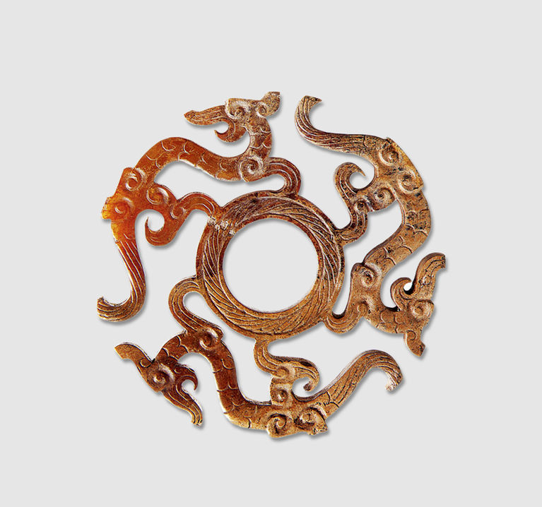 透雕夔龙黄玉佩