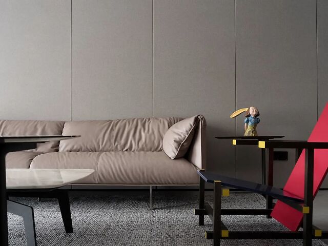 沙发墙整体以暖灰色调的硬包背景墙搭配浅咖色的皮沙发,呈现出一种