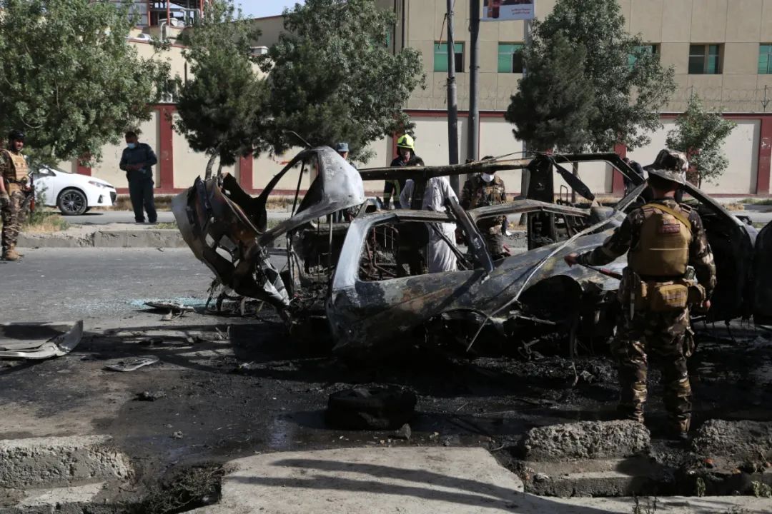 On June 12, Afghan security personnel investigated the explosion site in Kabul.  Published by Xinhua News Agency (Photo by Said Mominzada)