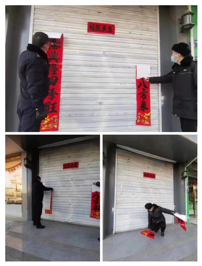 城管局工作人员正在对破损的春联进行修复(受访者供图)