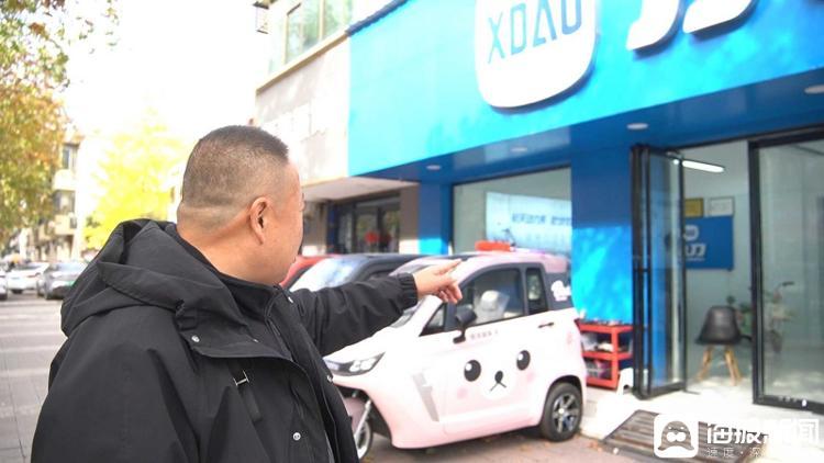当年的彩票店已经改成了电动车店