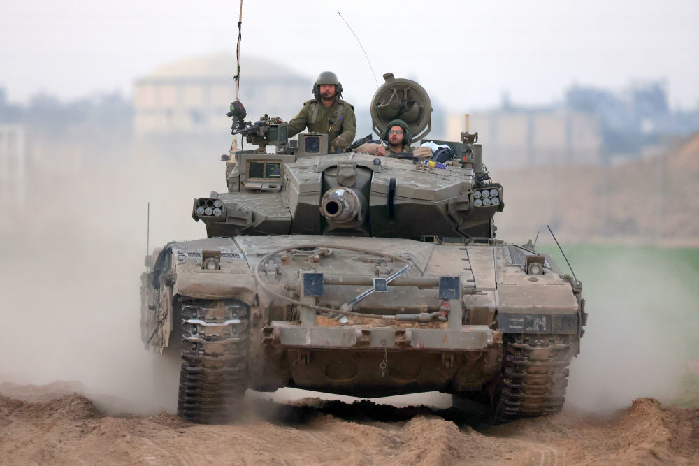 这是1月6日拍摄的加沙边境以色列一侧的以军部队。新华社发（伊兰·阿萨亚格摄/基尼图片社）