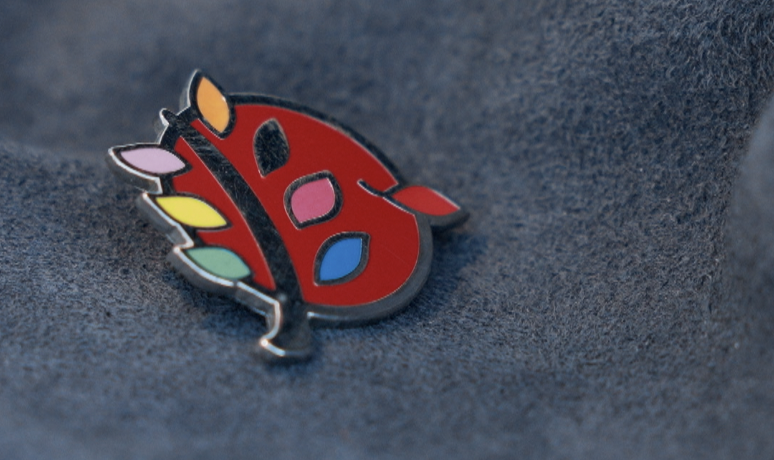 “选择与尊严”网站logo胸针