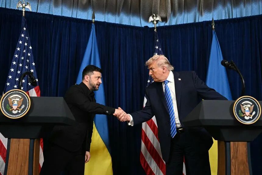 US President Donald Trump and Ukrainian President Volodymyr Zelensky shake hands during a press conference following talks at Trump's Mar-a-Lago residence in Palm Beach, Florida, on Sunday.