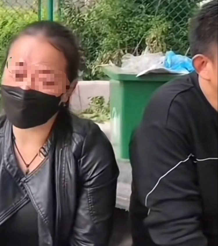 视频中的谢某和王某。视频截图