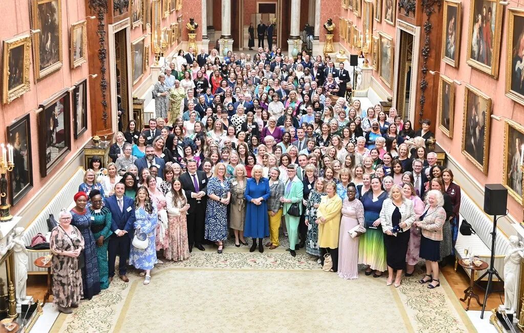 Camilla poses with guests at the event in 2024