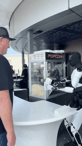 特斯拉开了家未来餐厅:机器人送来爆米花,我递钱包