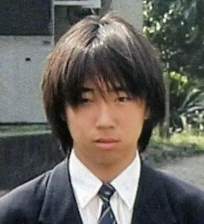 ·优季年轻时期的照片。(《神户新闻》)