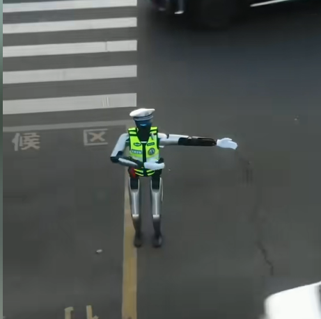 无锡街头惊现机器人交警 会指挥还会比耶合影
