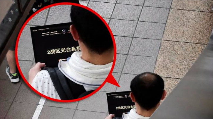 涉事男子表示,所谓“2战区光合系统”,只是投资专家及课程分组的代号,与“谍战”无关。图源:台媒报道配图