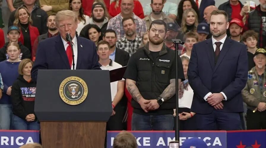 Trump invites mechanics onstage at Alaska rally to deliver pardons