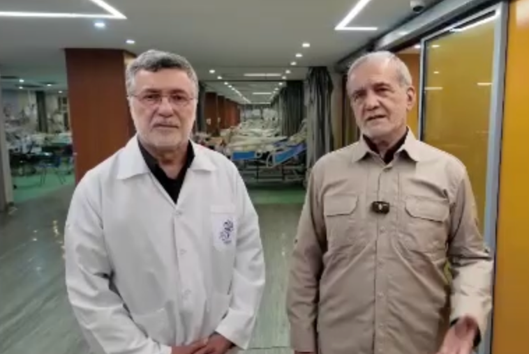 △伊朗总统佩泽希齐扬(右)