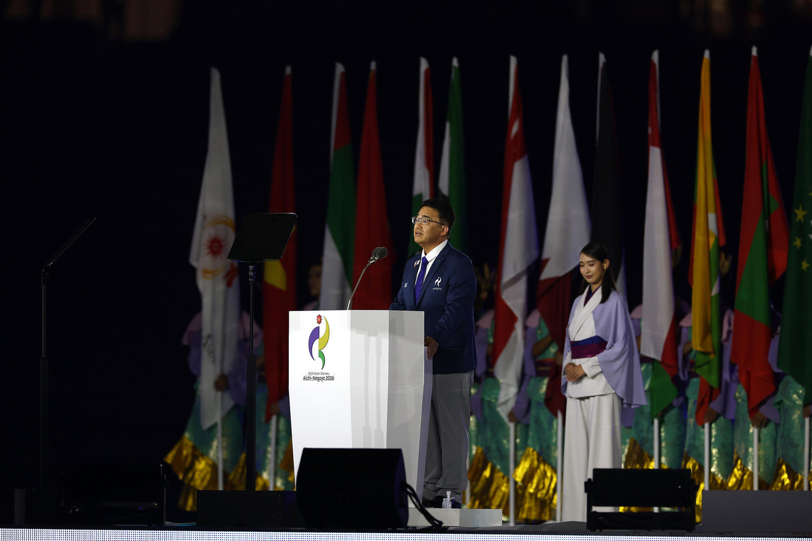▲当地时间2026年9月19日,2026爱知·名古屋亚洲运动会开幕式。爱知·名古屋亚运会组委会主席、爱知县知事大村秀章在2026爱知·名古屋亚洲运动会开幕式上致辞(图据视觉中国)