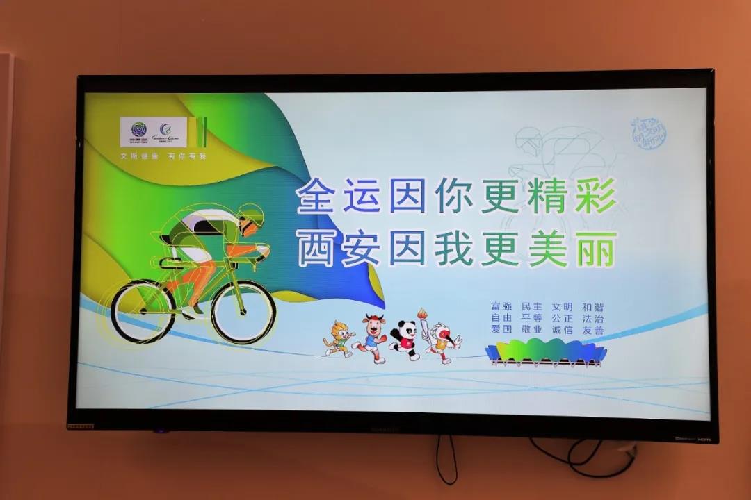 迎十四运氛围浓 公益广告,景观小品扮靓能源金贸区