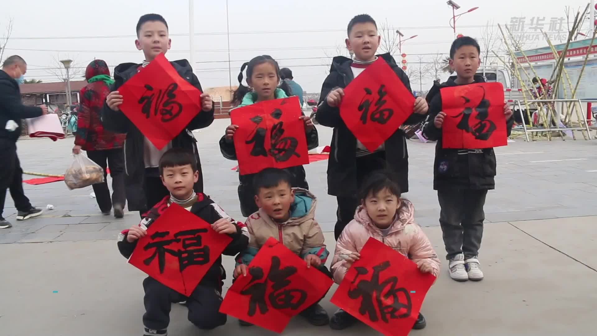 新春走基层｜领分红 分年猪 神东村里的幸福年