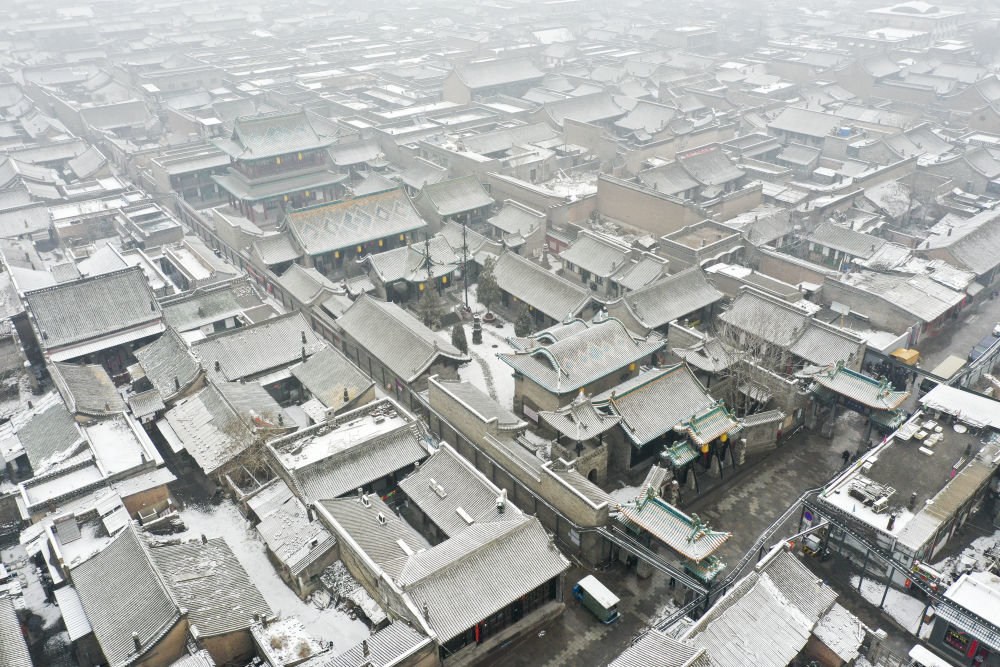 这是2月9日拍摄的平遥古城雪景（无人机照片）。
