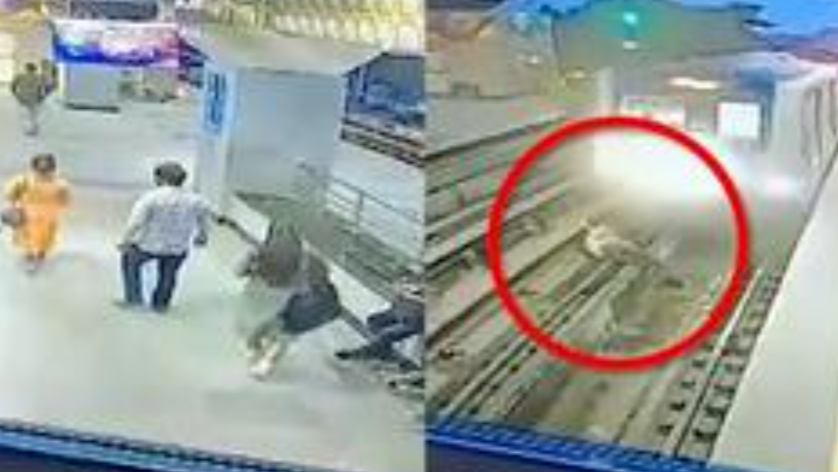 印度男子在地铁将进站时突然抱着妻子跳入铁轨，妻子不断挣扎但无法逃脱