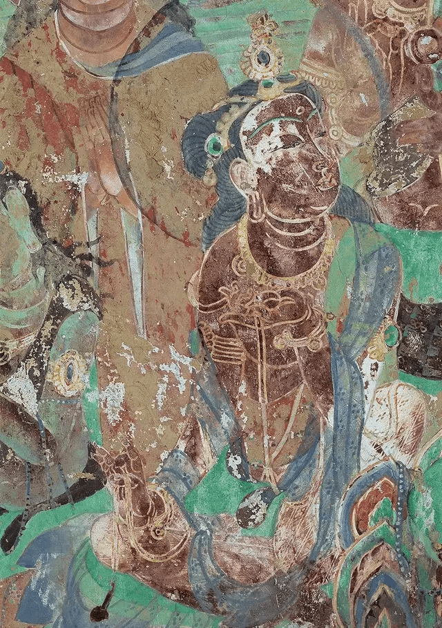 ▲供养菩萨青发丰盈,珠宝为饰。坐在莲花座上,两手一托一压,兰花指执丝带,动作优美。图片来自莫高窟官方微博