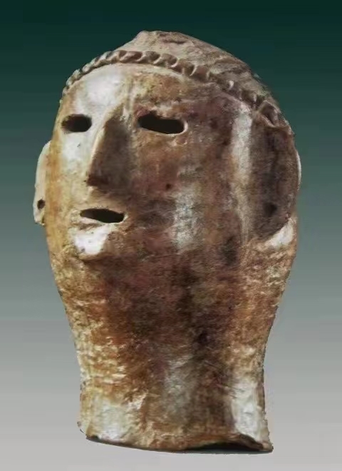 礼县高寺头仰韶文化遗址出土的“人首形器物盖”