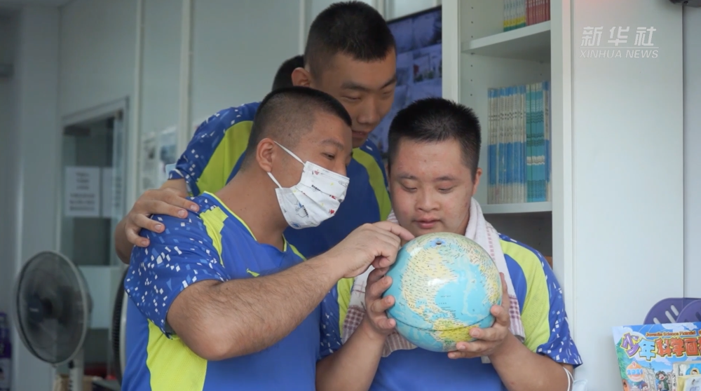 深圳：一群“喜憨儿”九年洗了10万台车