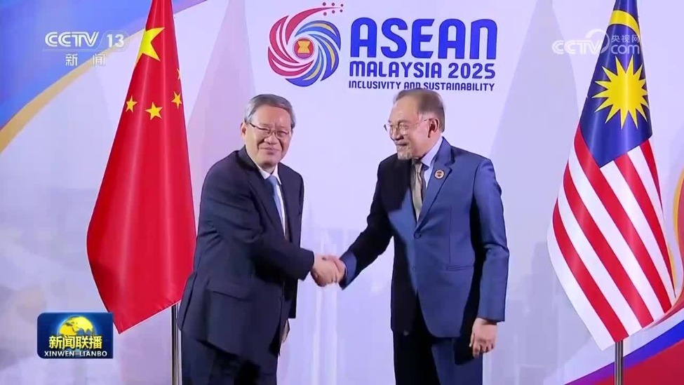 李强会见马来西亚总理