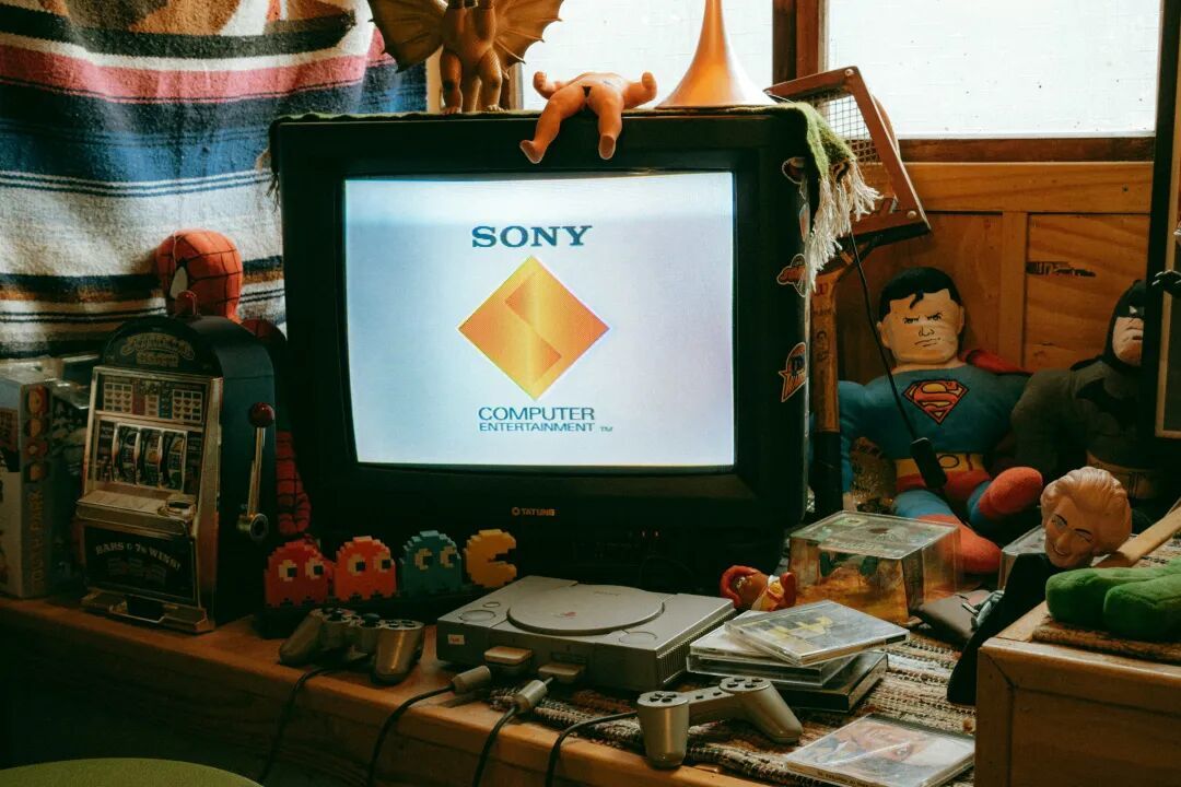 A computer monitor sitting on top of a wooden desk