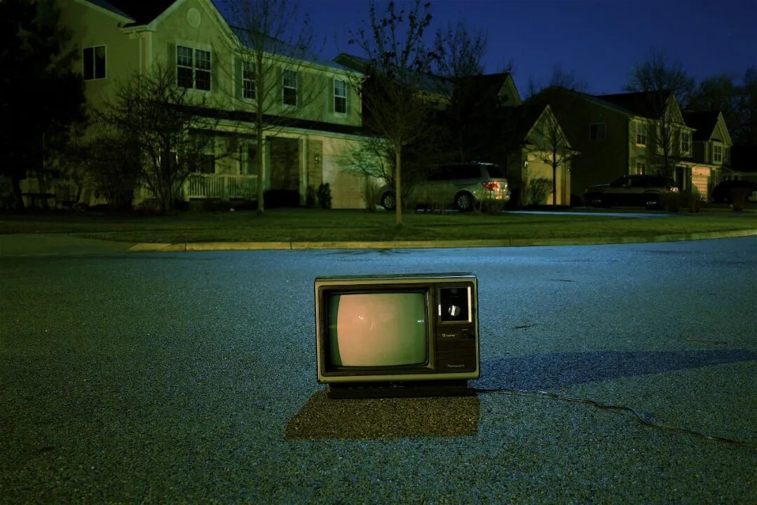turned off vintage CRT television on road