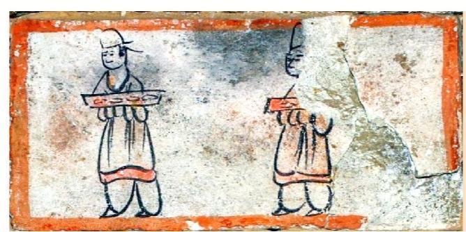 出土于嘉峪关新城魏晋墓六号墓,位于中室西壁从上而下第三层。画面内容为二仆人手捧长案前往给宾主送食物,长案上放有碗装食物。