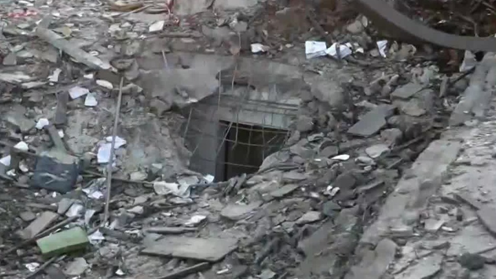 以安全屋遭击中，现场一片废墟，致9死11失踪