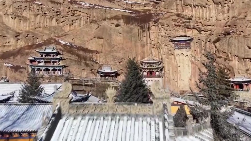 马蹄寺石窟群重层壁画下的梨车题记：并肩祈福 展现千年交融密码