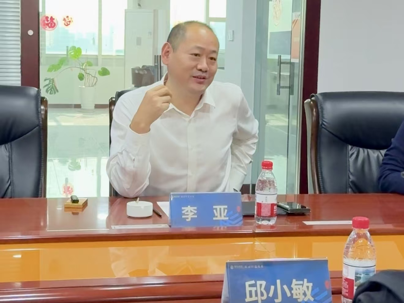 新华网上市公司研究院常务副院长邱小敏莅临理臣 双方达成深度合作共识
