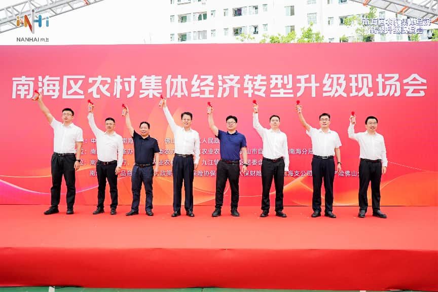 图为：九江镇水南社区新型村民住宅和集转国工作培土平整动工仪式