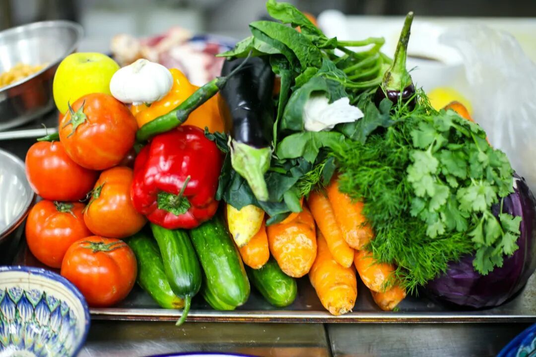 a pile of vegetables sitting on top of a table
