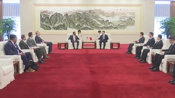 王小洪会见美国联邦调查局局长帕特尔