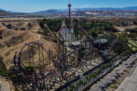 Aerial view of the X2 roller coaster winding through hills at Six Flags Magic Mountain